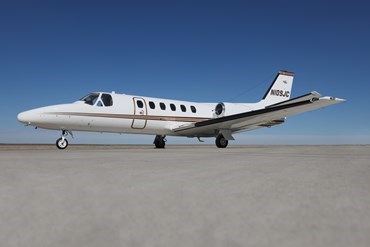 White aircraft on runway